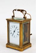 Early 20th Century brass cased carriage clock, the white dial with Roman numerals and outer