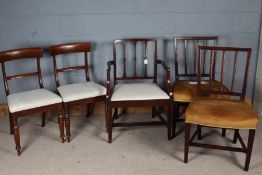 Pair of Victorian mahogany dining chairs, with reeded splat backs and over-stuffed seats, on