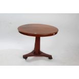 Victorian mahogany tilt top breakfast table, the circular top raised on column and tri-foil base,