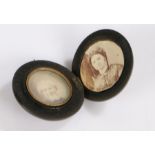 Victorian vulcanite locket, enclosing two portrait minitures of a lady and a gentleman, surrounded