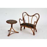 Miniature Edwardian bamboo settee and matching table, settee 17.5cm long, table 9.5cm diameter (2)