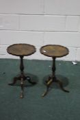 Pair of 20th century walnut wine tables, each with piecrust tops and tripod legs (2)