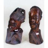 Pair of Yoruba carved darkwood busts, female and male, with incised decorations, 37cm and 36cm