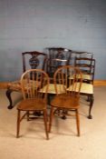 Pair of Chippendale style mahogany dining chairs, with fret carved slats, raised on claw on ball
