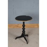 Neoclassical style occasional table, the ebonised and gilt circular top raised on a turned stem