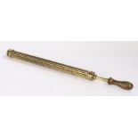 Brass air cane pump, the turned wooden handle above the reeded brass body, 64cm long