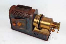 Early 20th century tin plate and brass magic lantern, together with two wooden boxes of slides -