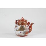 Japanese Kutani teapot, 20th century, having lift up lid, shaped rim and painted in iron red and