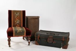 Victorian nursing chair, with needlework upholstery and raised on mahogany legs with brass and