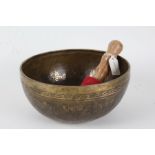 Eastern bronze singing bowl, the interior with script and buddha, the exterior also with script,