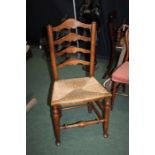 19th Century elm ladder back dining chair, the back with four splats above a cane seat, raised on