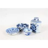 Four items of Chinese blue and white porcelain, to include, tea caddy, a saucer dish, with character