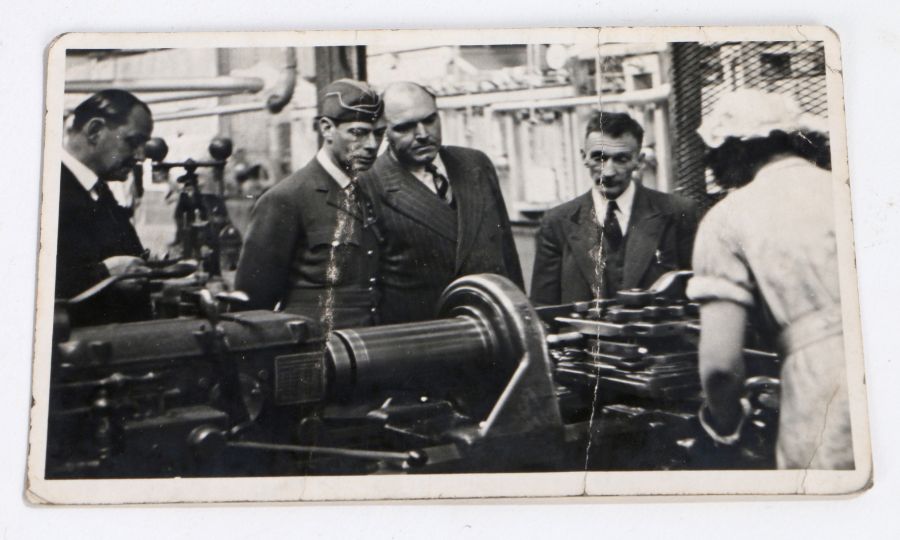 20th Century black and white postcard, depicting King George VI at a factory, circa 1941, 13.5cm