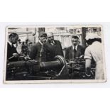 20th Century black and white postcard, depicting King George VI at a factory, circa 1941, 13.5cm