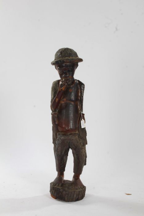 African carved wooden figure, in the form of a fisherman and modelled in a standing position, 83cm