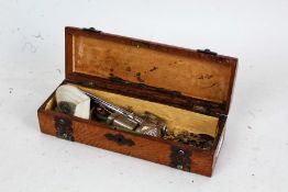 Late Victorian golden oak glove box containing a De La Rue & Co. pocket inkwell, badges, jewellery