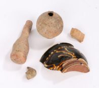 Archaeological finds to include terracotta flask and bottle, bird's head, figure's head, slipware