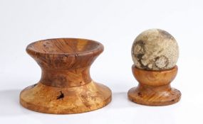 Turned wooden display plinths for cannon balls, the first is 9.5 cm in height, 12.5 cm in