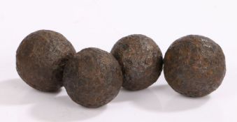 Four 18th/19th century grapeshot/canister shot balls, approx 3.5 cm in diameter, (4)