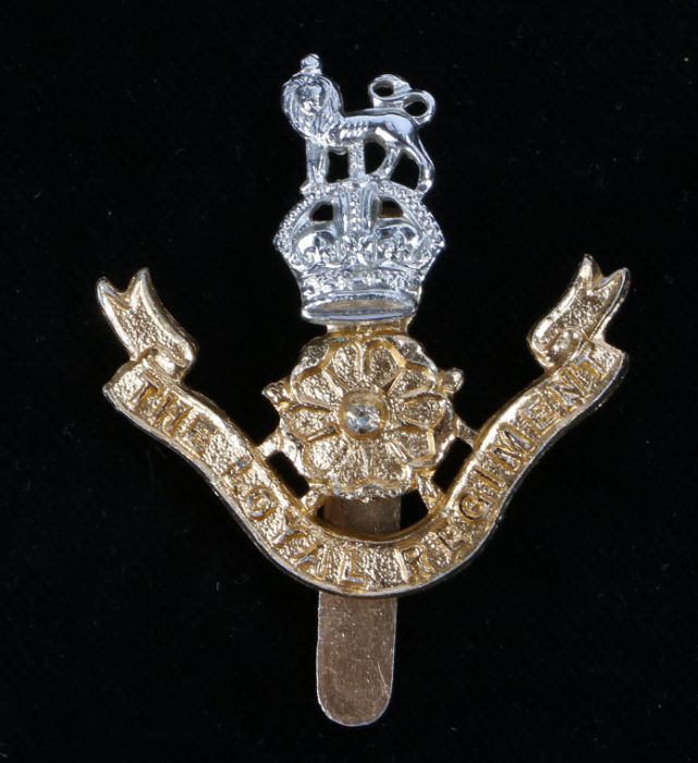 Scarce British army cap badge in anodised aluminium to The Loyal Regiment (North Lancashire), pre