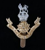 Scarce British army cap badge in anodised aluminium to The Loyal Regiment (North Lancashire), pre