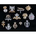 Selection of British army cap badges in anodised aluminium to include, The Border Regiment, slider