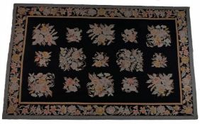Aubusson style wool carpet, the black field with foliate sprigs and foliate border, 267cm x 168cm