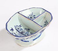 19th Century Dutch Delft dish, with three reserves decorated with flowers internally, the outside