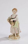 Meissen porcelain figure, of a young lady with flowers in her folded hat, her bare feet on a gilt