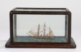 19th Century ship model, depicting a three masted vessel, housed in a glazed case, 27cm wide, 14cm