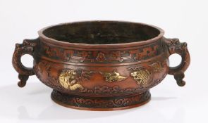 Chinese bronze censer, with dog of fo cast handles, the body with raised gilt decoration depicting