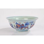 Chinese porcelain bowl, Ming style, with blue and copper red dogs of foo and cloud decoration, six