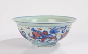 Chinese porcelain bowl, Ming style, with blue and copper red dogs of foo and cloud decoration, six