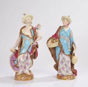 Meissen, Two figures from Malabar, circa 1860, both wearing straw hats and purple cloaks with fur