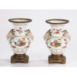 Pair of porcelain and metal mounted vases, the wide rim with a ball metal framed edge above a pair