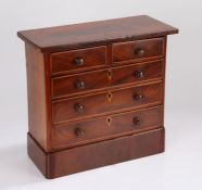George III mahogany miniature chest of two short and three long drawers, the drawers with turned
