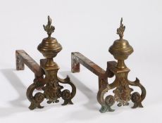 Pair of Neo Classical style fire dogs, with a flaming urn above a bust flanked by the arched legs,