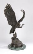 After Jules Moigniez (1835-1894), a large bronze sculpture of an eagle with prey, signed to the