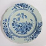 Chinese blue and white porcelain charger, the centre with a willow tree over hanging ceremonial