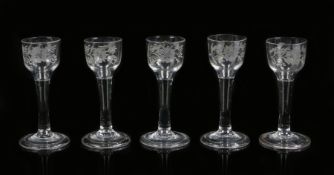 Matched set of five Jacobite type glasses, 18th Century, with a bowl engraved with a rose and bird