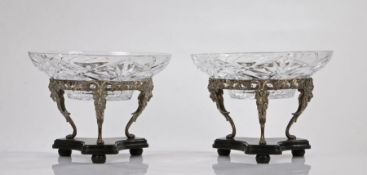 Pair of silver plated and cut glass table centre pieces, the associated cut glass bowls above a vine