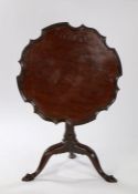 19th Century mahogany occasional table, the dished pie top above a turned tapering column raised