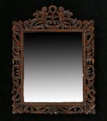 17th Century style Flemish oak wall mirror, the rectangular mirror with carved with a angels holding