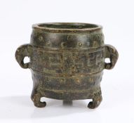 Chinese bronze censer, with elephant mask cast handles, raised on three elephant mask feet, four