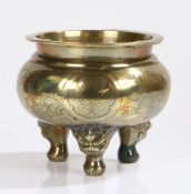 Chinese brass censer, the rounded body with leaf etched decoration above dragon mask feet, 18cm