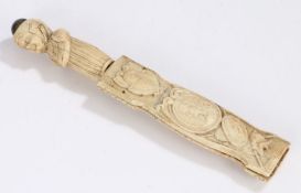 17th Century bone dagger, the figural carved handle above a steel blade, the scabbard with carved