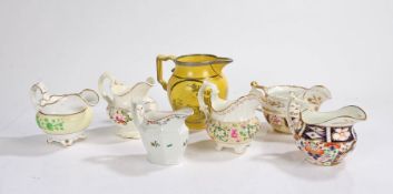 Collection of  seven 19th Century pottery and porcelain jugs, to include a Staffordshire yellow