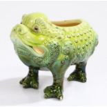 Burmantofts Faience Pottery Grotesque toad spoon warmer, in bright to dark green standing on three