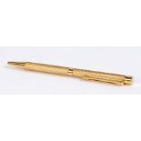 Sheaffer 18 carat gold ball point pen, with an engine turned case, 13cm long