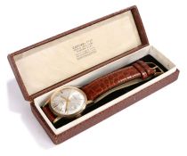 Garrard 9 carat gold gentleman's wristwatch, the signed silver dial with baton markers, Arabic 12